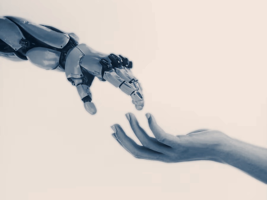 Robothand en mensenhand die naar elkaar reiken, beeld bij de megatrend AI